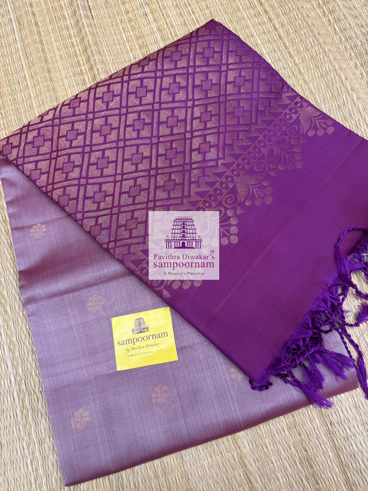 Lavender with Purple , rich Zari Butta in the body , Plain borders , rich Pallu Handloom Semi Soft Silk Saree
