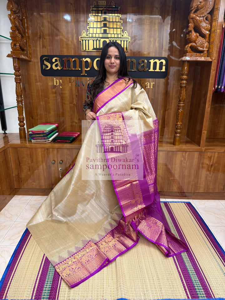 Beige with Purple , Zari Podi Kattam in the body , traditional one side short and long borders with rich Pallu Korvai Silk Cotton Saree