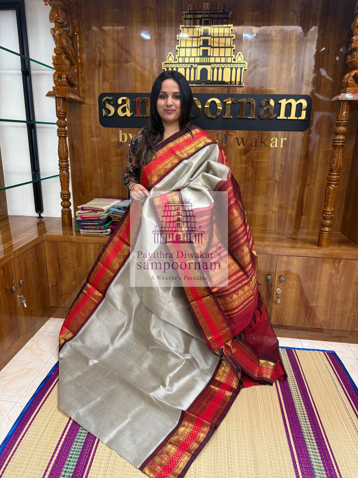 Light Grey with Red , Lakshadeepam borders and rich Pallu Zari butta in the body Korvai Silk Cotton Saree