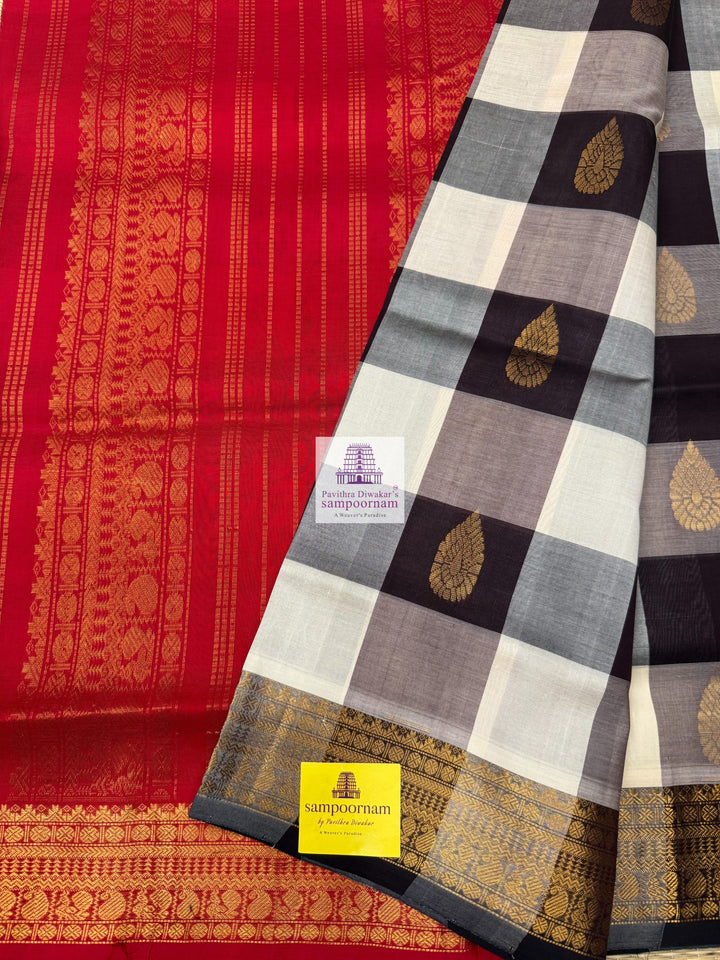 White , Brown  and Grey with Red , Mango butta in the body , traditional borders and rich Pallu Silk Cotton Saree