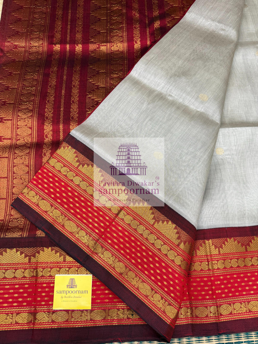 Light Grey with Red , Lakshadeepam borders and rich Pallu Zari butta in the body Korvai Silk Cotton Saree