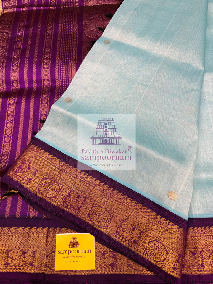 Teel Blue with Purple  , Zari butta in the body , traditional borders with rich Pallu Korvai Silk Cotton Saree