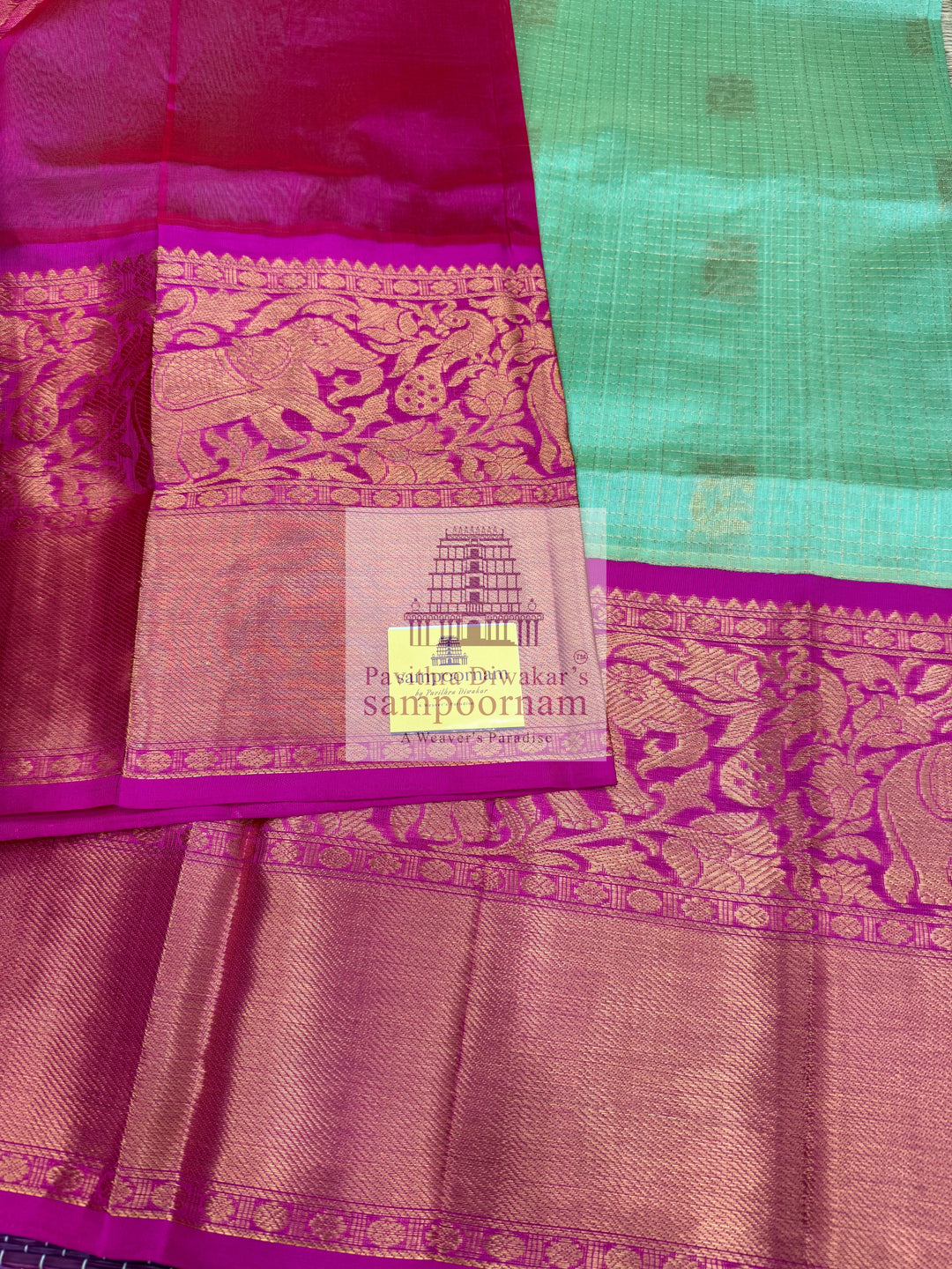 Pista Green with Rani Pink , rich Zari Podi Kattam in the body , one side short and long borders with rich Pallu Korvai Silk Cotton Saree
