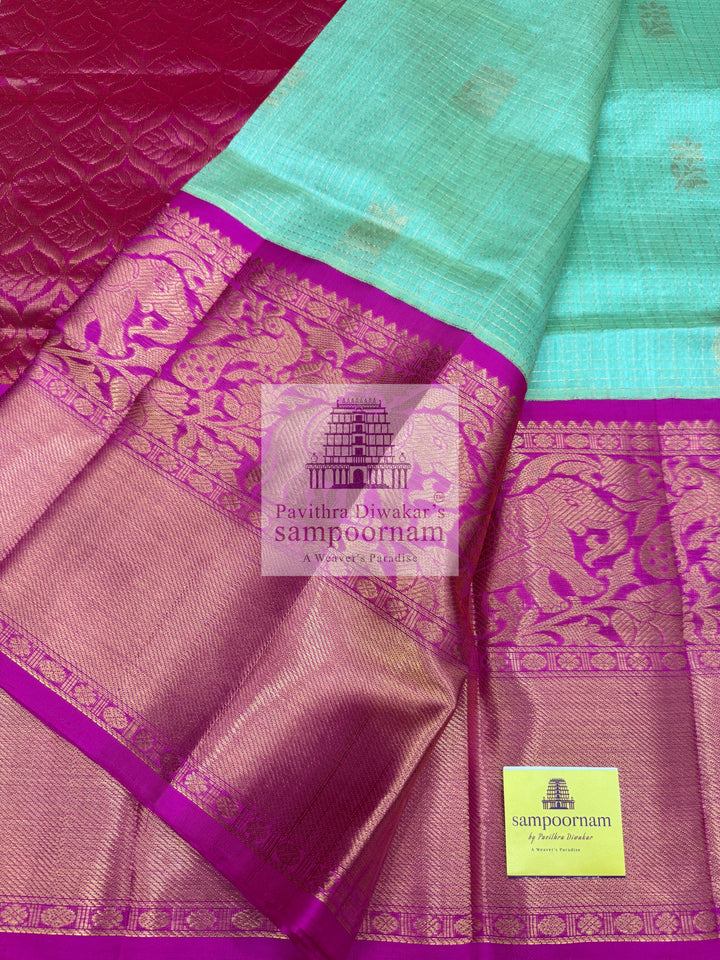 Pista Green with Rani Pink , rich Zari Podi Kattam in the body , one side short and long borders with rich Pallu Korvai Silk Cotton Saree