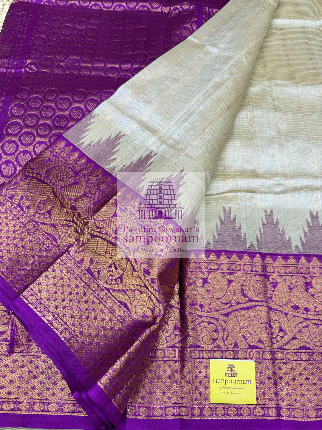 Beige with Purple , Zari Podi Kattam in the body , traditional one side short and long borders with rich Pallu Korvai Silk Cotton Saree