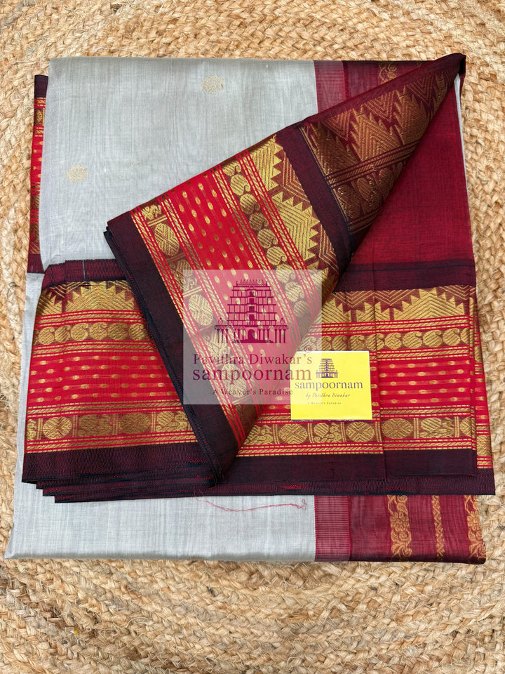 Light Grey with Red , Lakshadeepam borders and rich Pallu Zari butta in the body Korvai Silk Cotton Saree