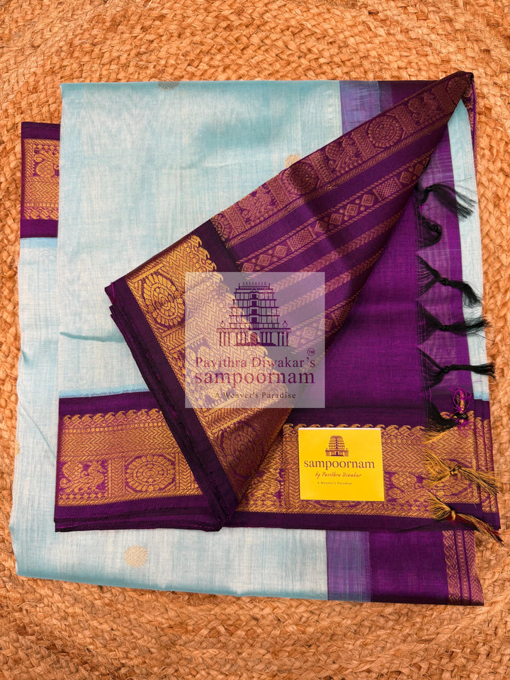 Teel Blue with Purple  , Zari butta in the body , traditional borders with rich Pallu Korvai Silk Cotton Saree