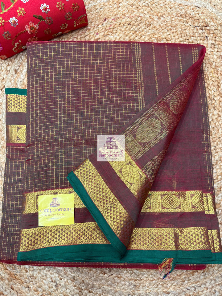 Manthulir , Green Selvedge  , Zari checks in the body , traditional border and rich Pallu Silk Cotton Saree