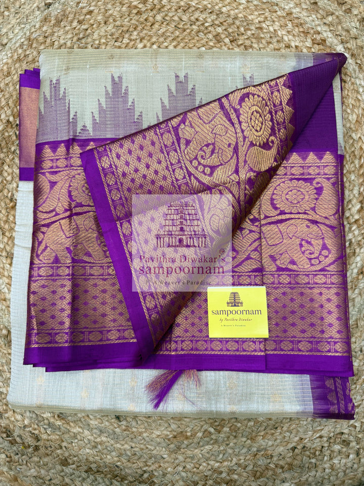 Beige with Purple , Zari Podi Kattam in the body , traditional one side short and long borders with rich Pallu Korvai Silk Cotton Saree