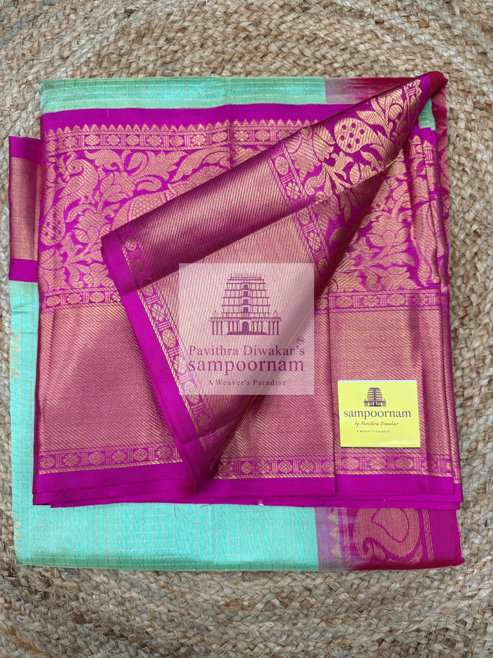Pista Green with Rani Pink , rich Zari Podi Kattam in the body , one side short and long borders with rich Pallu Korvai Silk Cotton Saree