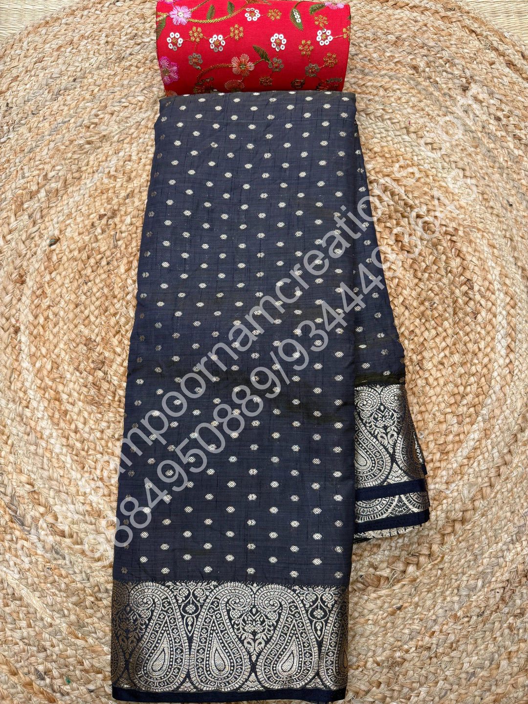Black with Zari Buttas all over the body , Traditional rich Mango designs in the border and Tissue Pallu , Semi Tussar Saree