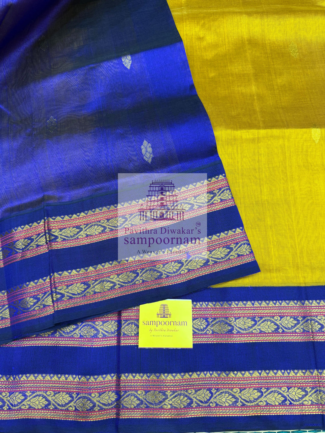 Dark Gold with Dark Blue , Zari butta in the body , rettapet borders and Zari checks in the body , rich Pallu Korvai Silk Cotton Saree