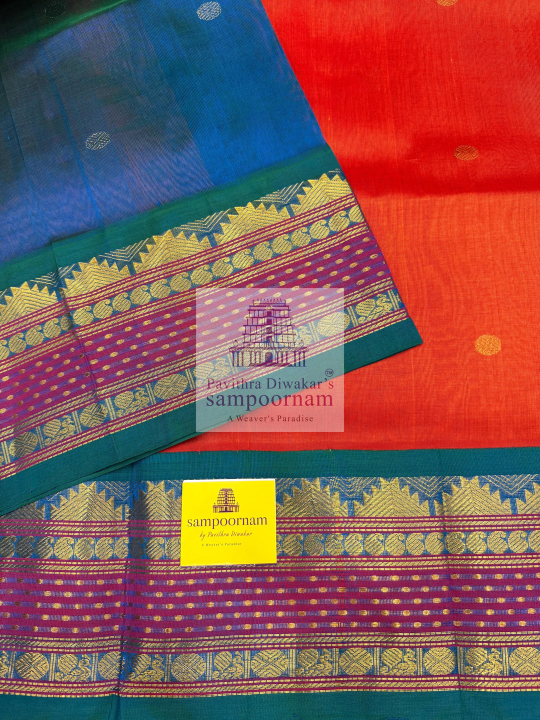 Rust Orange with Mayikazhuthu Blue , Lakshadeepam borders and rich Pallu Zari butta in the body Korvai Silk Cotton Saree