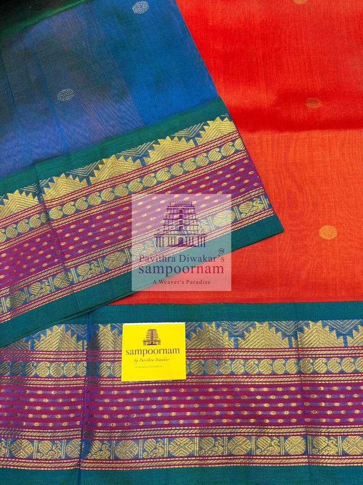 Rust Orange with Mayikazhuthu Blue , Lakshadeepam borders and rich Pallu Zari butta in the body Korvai Silk Cotton Saree