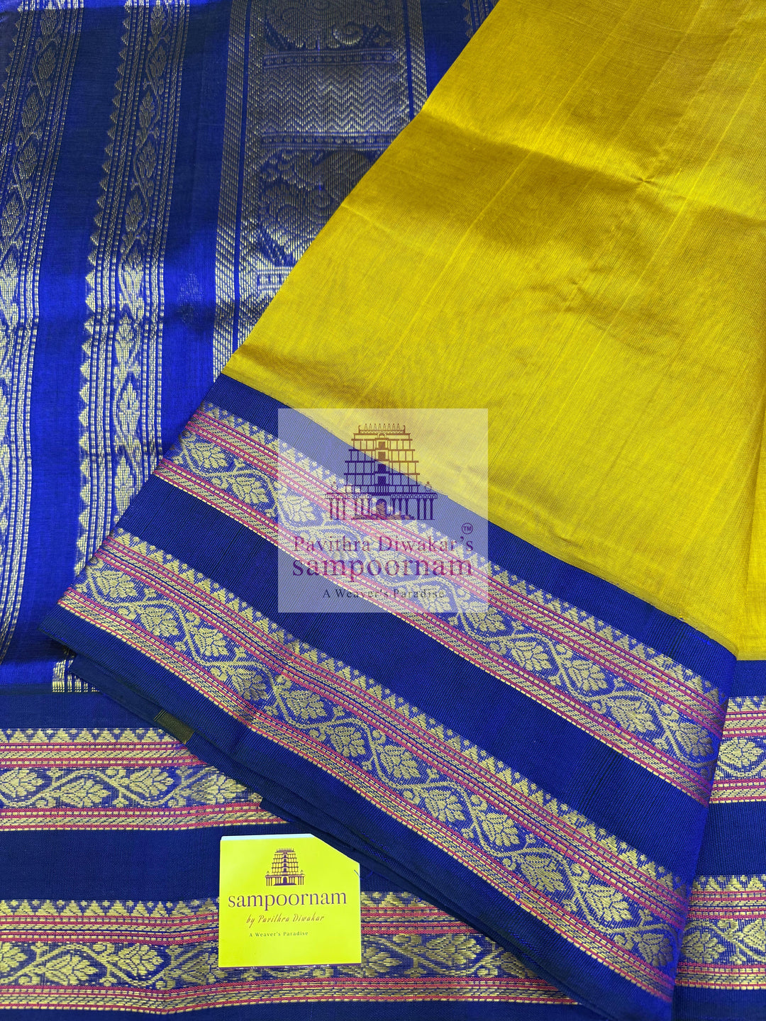 Dark Gold with Dark Blue , Zari butta in the body , rettapet borders and Zari checks in the body , rich Pallu Korvai Silk Cotton Saree