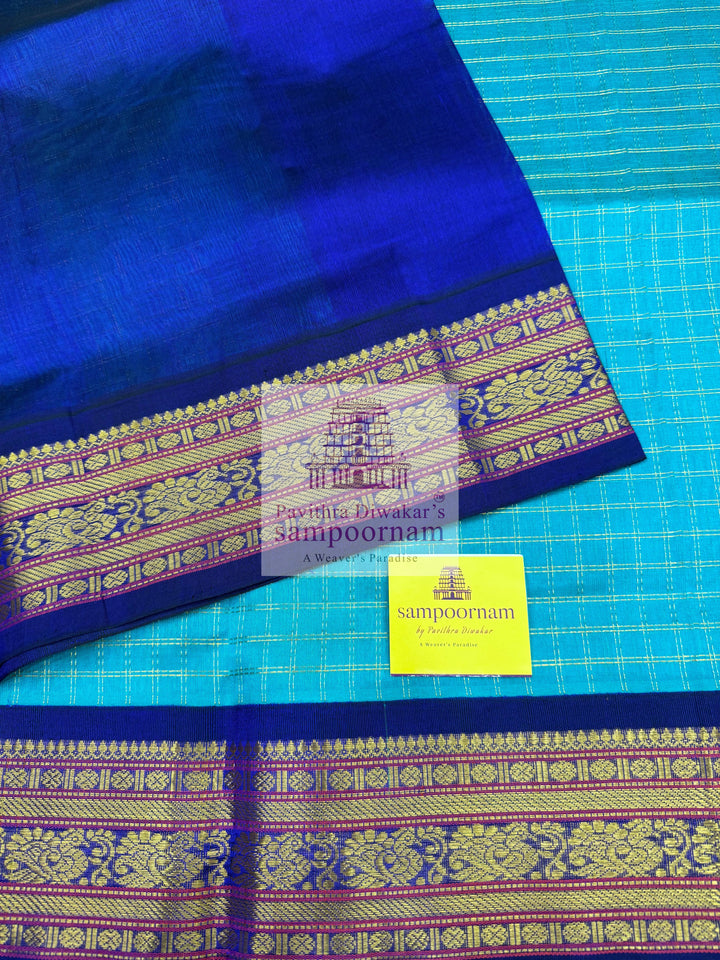 Ramar Blue with Blue  , Zari checks in the body , traditional borders with rich Pallu Korvai Silk Cotton Saree