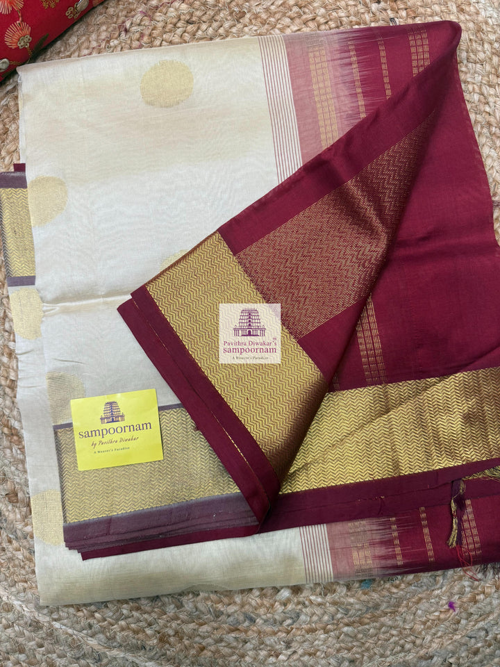 Light Gold with Red , rich Zari butta in the body , traditional border and traditional border and Rich Pallu Silk Cotton Saree