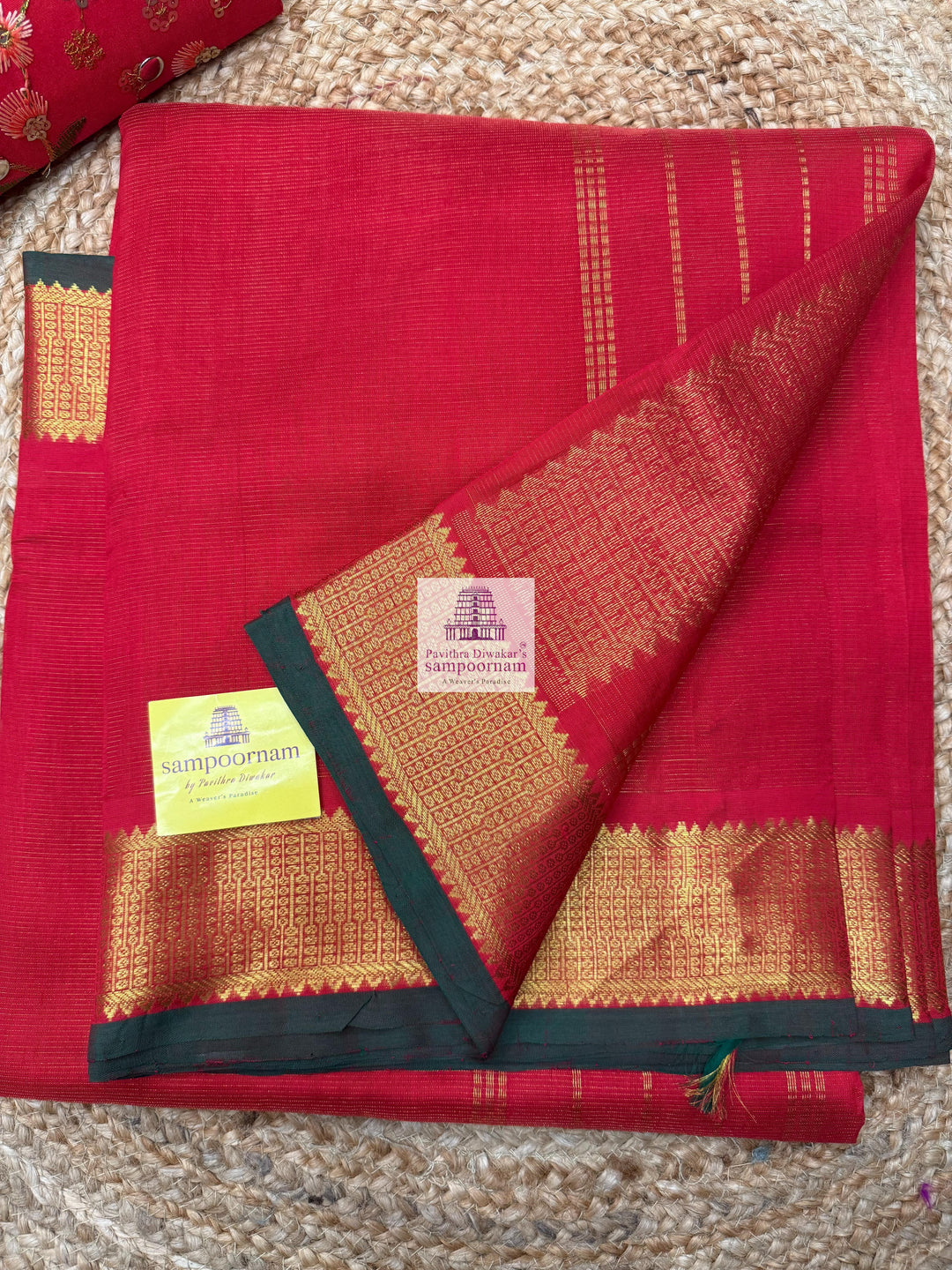 Passion Red , Green Selvedge , Vairaoosi Zari lines in the body , traditional borders and rich Pallu Silk Cotton Sarees