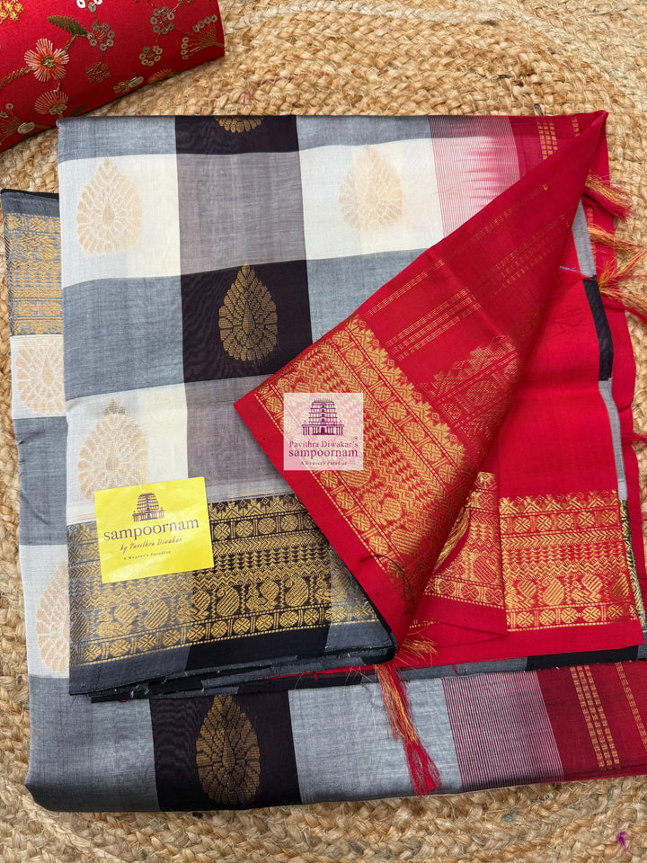 White , Brown  and Grey with Red , Mango butta in the body , traditional borders and rich Pallu Silk Cotton Saree
