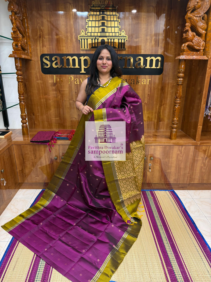 Purple with Mehandi Green , rich Zari Butta in the body , Plain borders , rich Pallu Handloom Semi Soft Silk Saree
