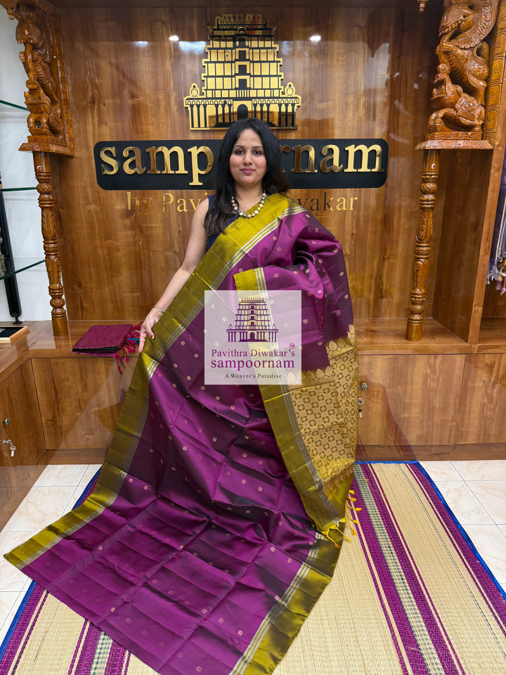 Purple with Mehandi Green , rich Zari Butta in the body , Plain borders , rich Pallu Handloom Semi Soft Silk Saree