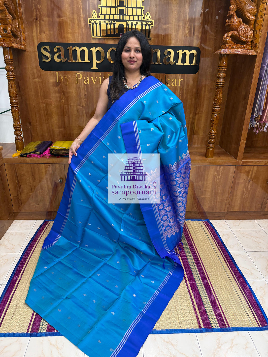 Blue with Dark Blue , rich Zari Butta in the body , Plain borders , rich Pallu Handloom Semi Soft Silk Saree