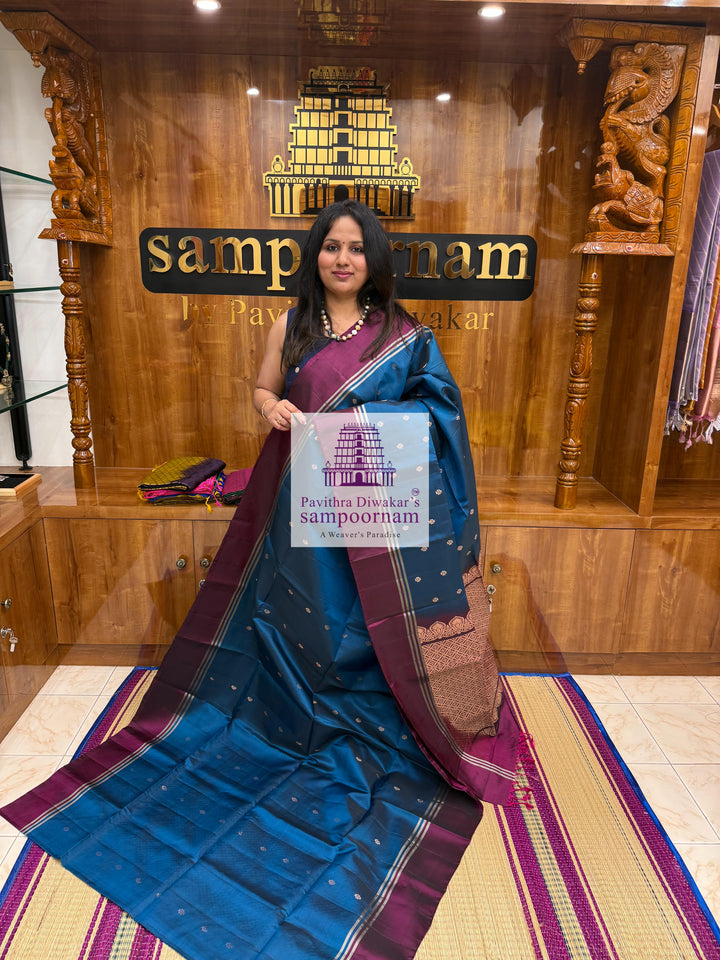 Classic Blue with Magenta , rich Zari Butta in the body , Plain borders , rich Pallu Handloom Semi Soft Silk Saree