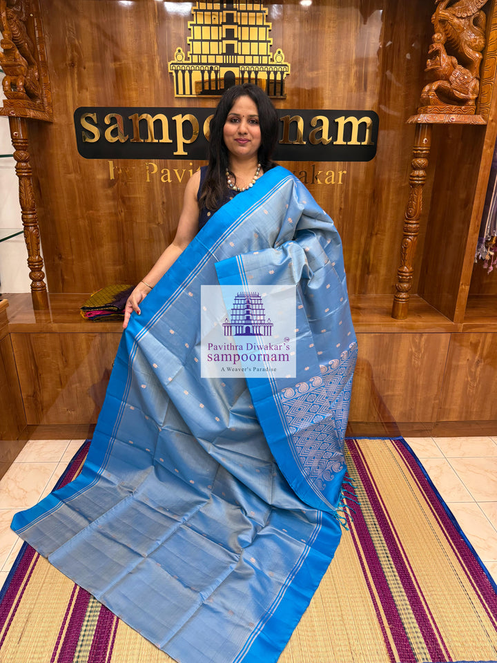 Light Blue with Blue , rich Zari Butta in the body , Plain borders , rich Pallu Handloom Semi Soft Silk Saree