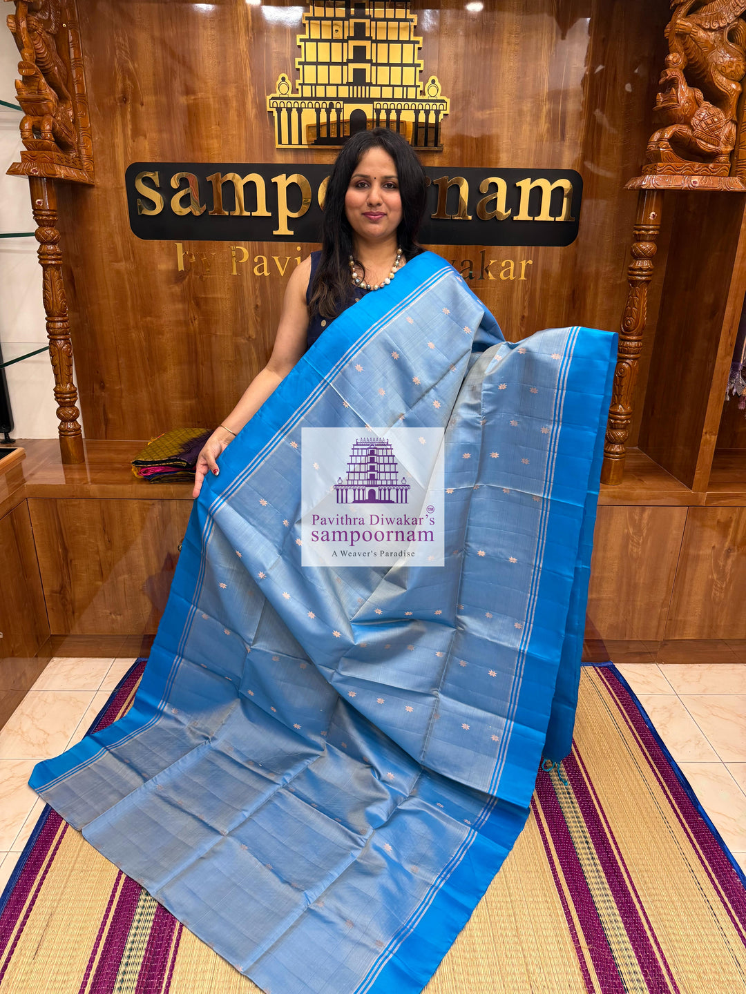 Light Blue with Blue , rich Zari Butta in the body , Plain borders , rich Pallu Handloom Semi Soft Silk Saree