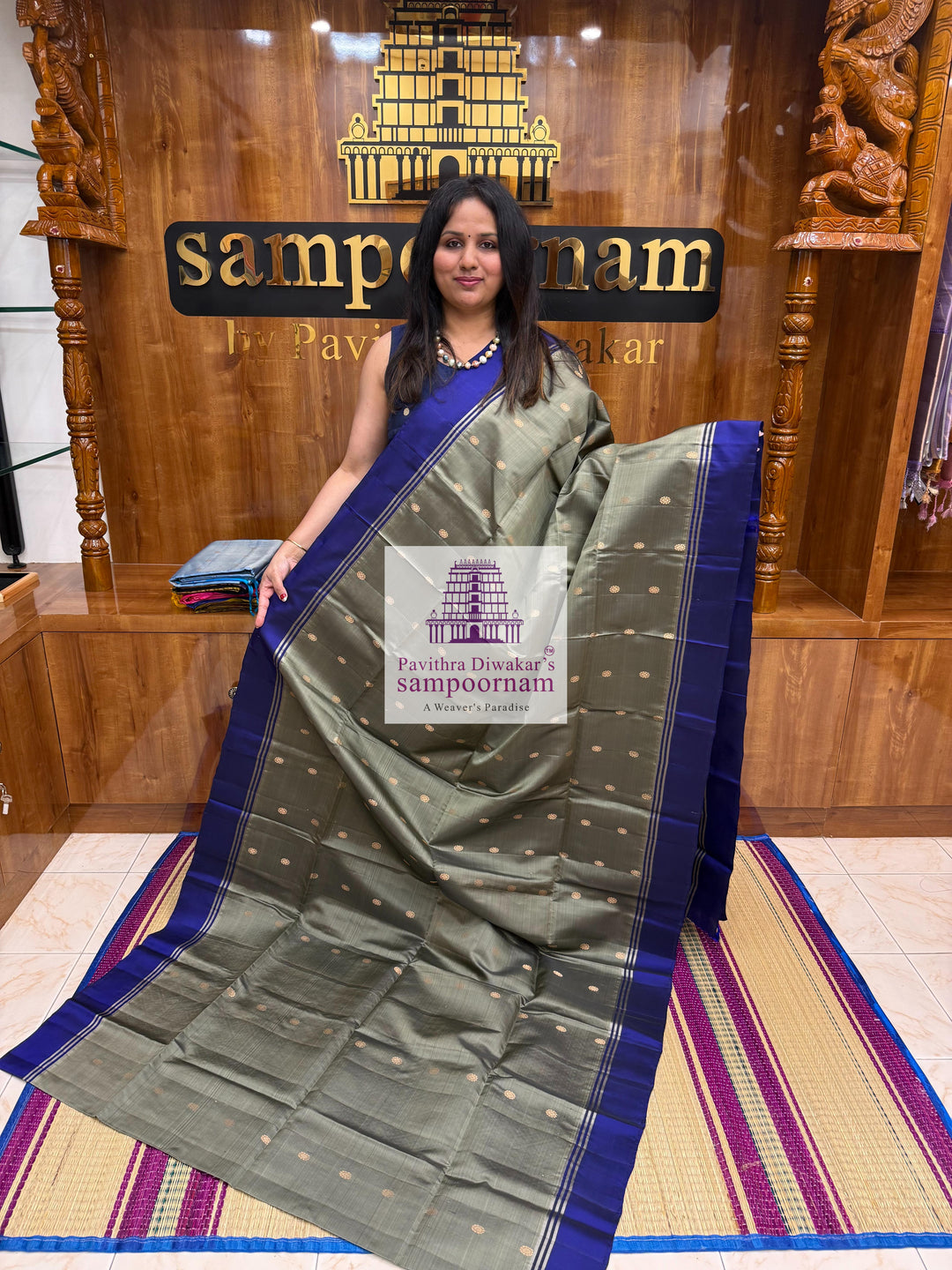 Greenish Grey with Dark Blue , rich Zari Butta in the body , Plain borders , rich Pallu Handloom Semi Soft Silk Saree