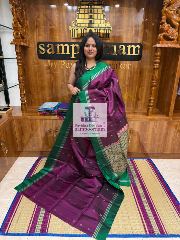Wine with Green , rich Zari Butta in the body , Plain borders , rich Pallu Handloom Semi Soft Silk Saree