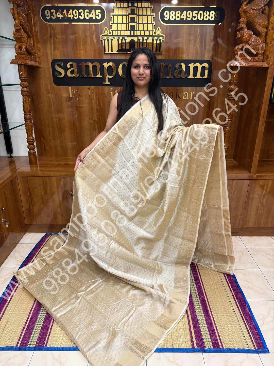 Offwhite with Zari Buttas all over the body , Traditional rich Mango designs in the border and Tissue Pallu , Semi Tussar Saree