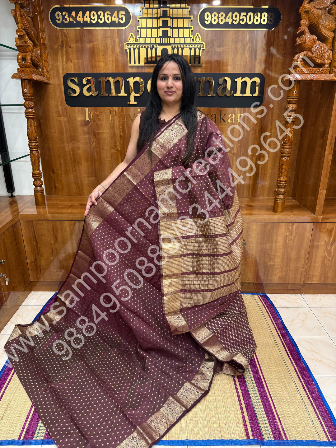 Burgundy with Zari Buttas all over the body , Traditional rich Mango designs in the border and Tissue Pallu , Semi Tussar Saree