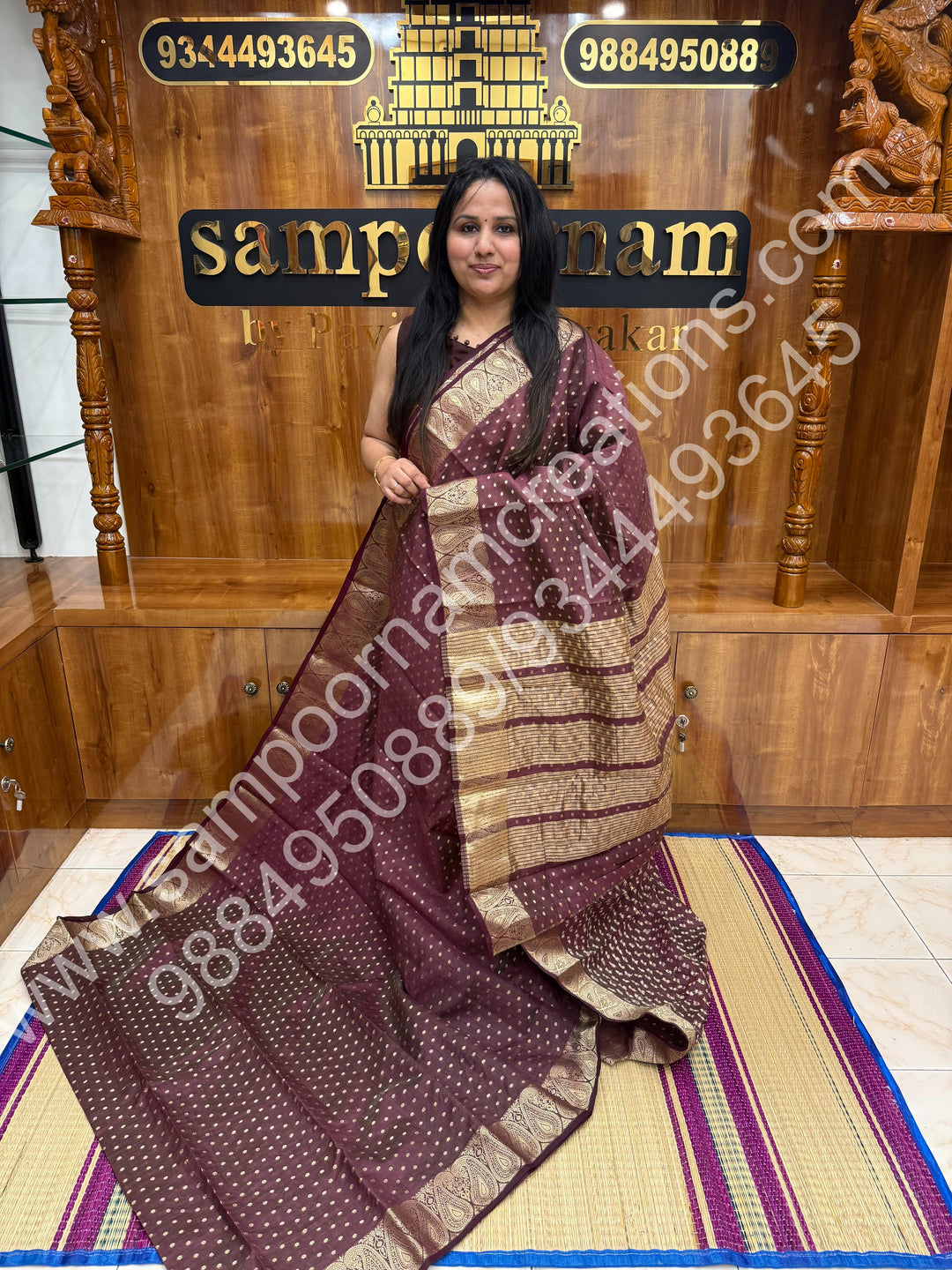 Burgundy with Zari Buttas all over the body , Traditional rich Mango designs in the border and Tissue Pallu , Semi Tussar Saree