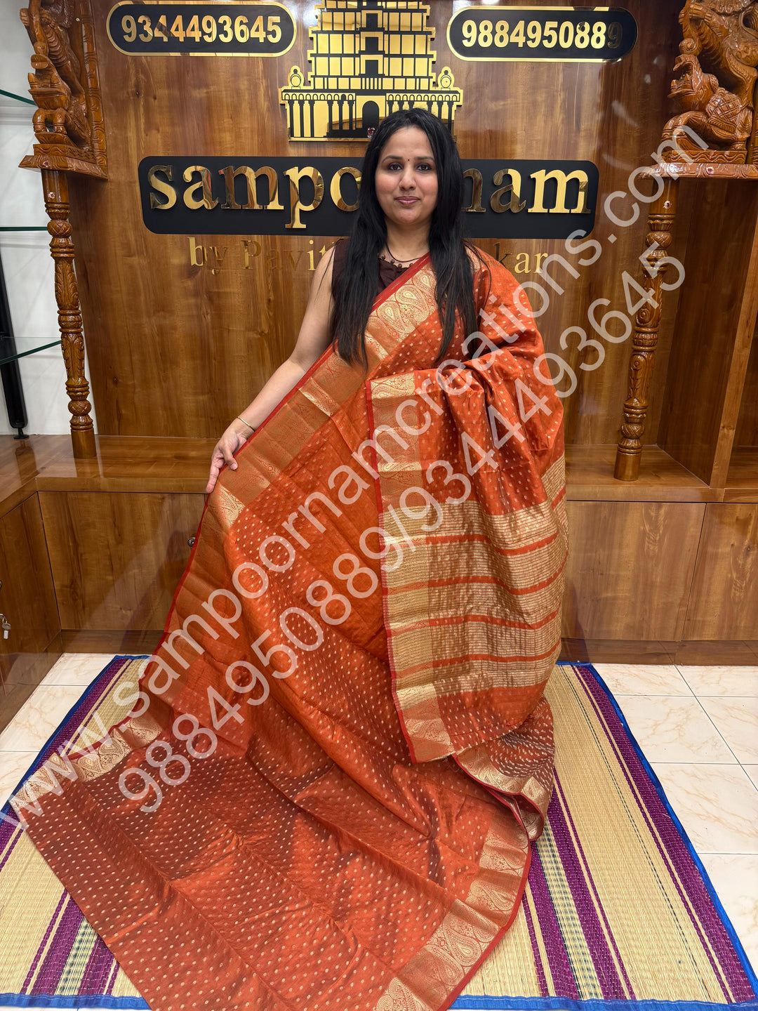 Rust Orange with Zari Buttas all over the body , Traditional rich Mango designs in the border and Tissue Pallu , Semi Tussar Saree