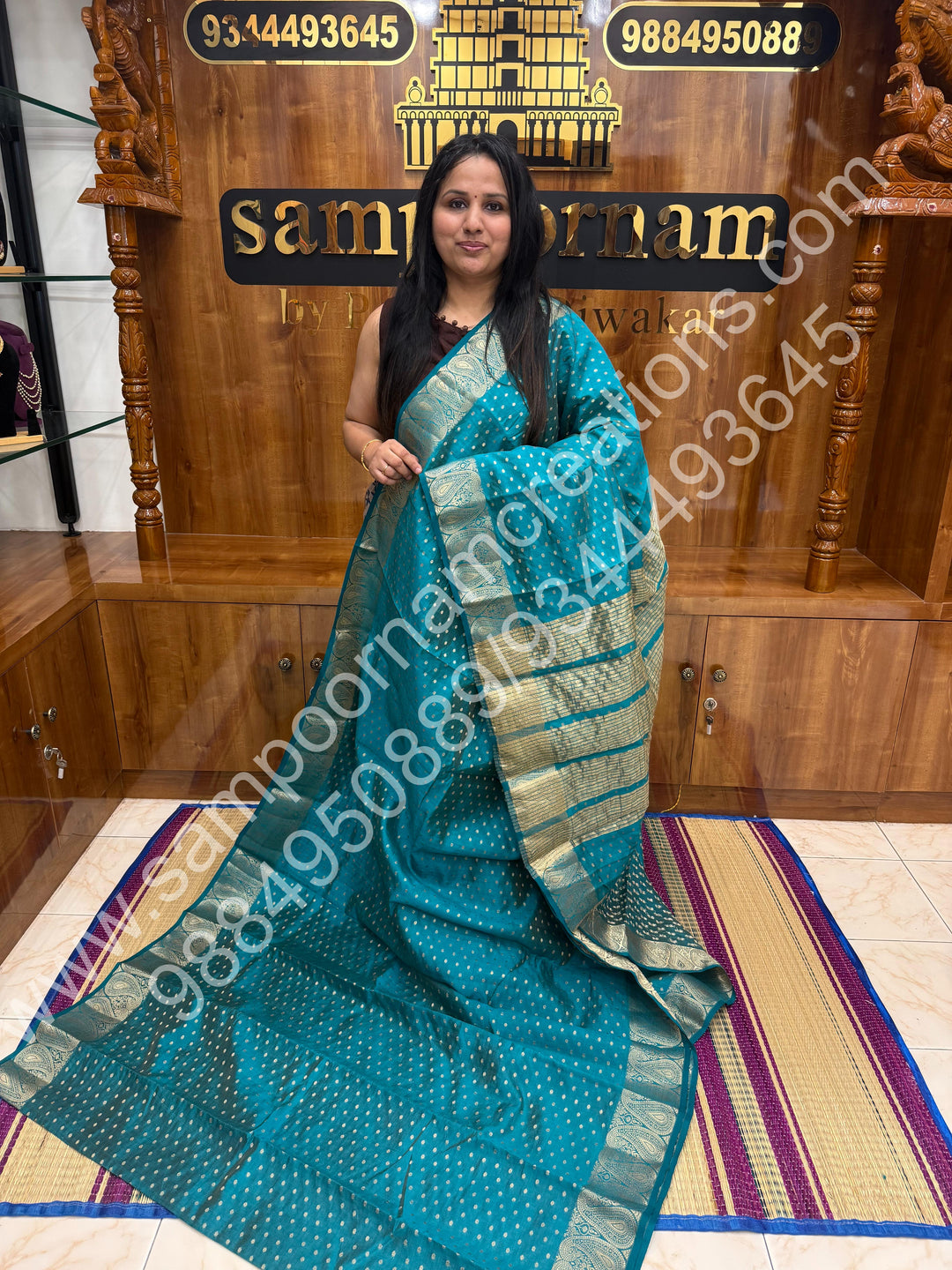 Turquoise Blue with Zari Buttas all over the body , Traditional rich Mango designs in the border and Tissue Pallu , Semi Tussar Saree