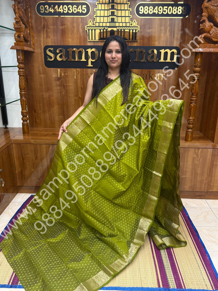 Leaf Green with Zari Buttas all over the body , Traditional rich Mango designs in the border and Tissue Pallu , Semi Tussar Saree