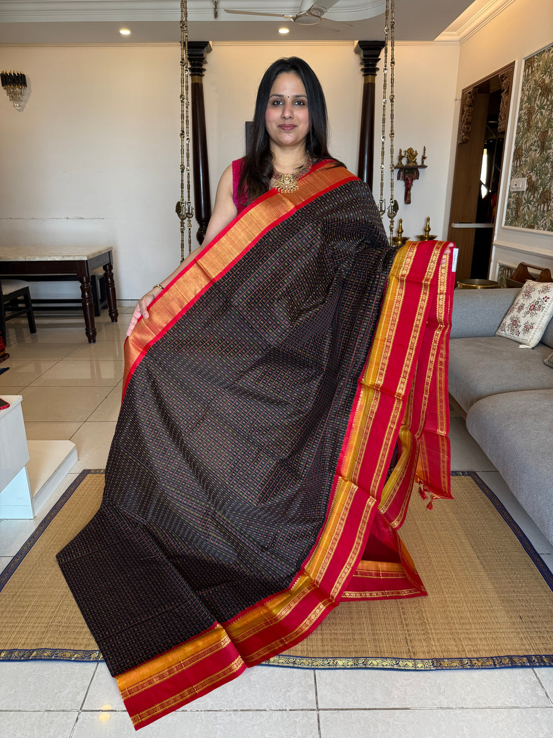 Black with red Lakshadeepam thread butta in the body , rettapet border and rich Pallu Korvai Silk Cotton Saree