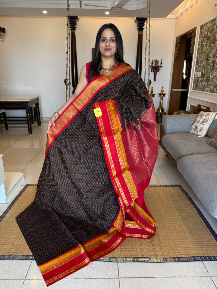 Black with red Lakshadeepam thread butta in the body , rettapet border and rich Pallu Korvai Silk Cotton Saree