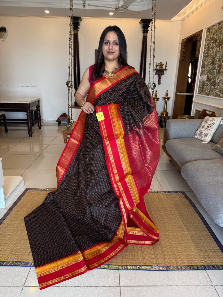 Black with red Lakshadeepam thread butta in the body , rettapet border and rich Pallu Korvai Silk Cotton Saree
