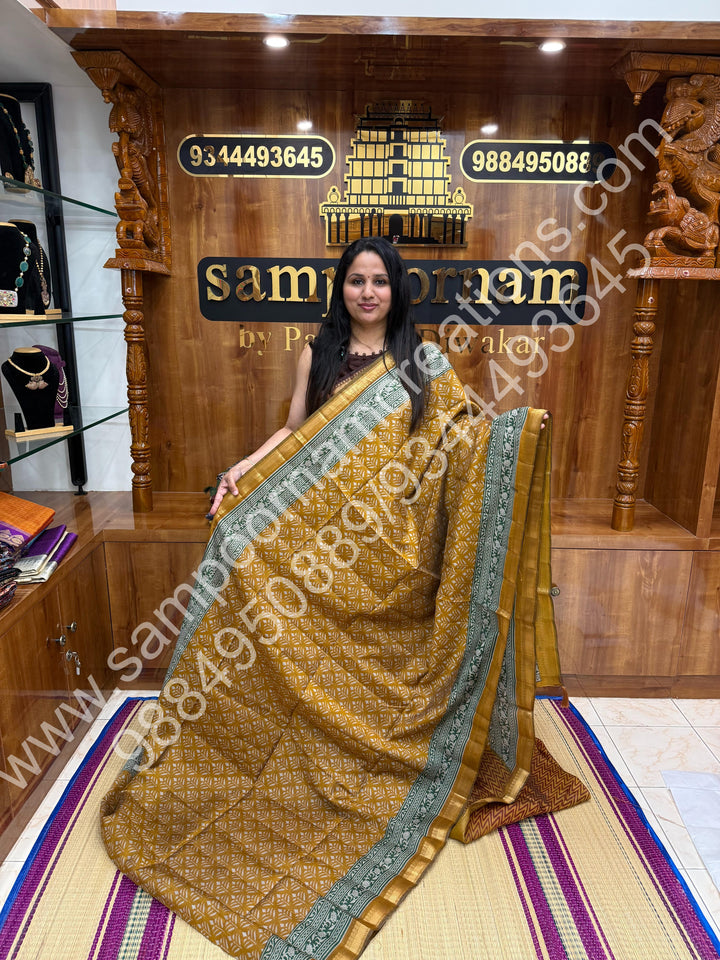 Mustard with Green  , Floral Prints in the body , Printed Blouse and Tassels in the Pallu , Soft Cotton Saree