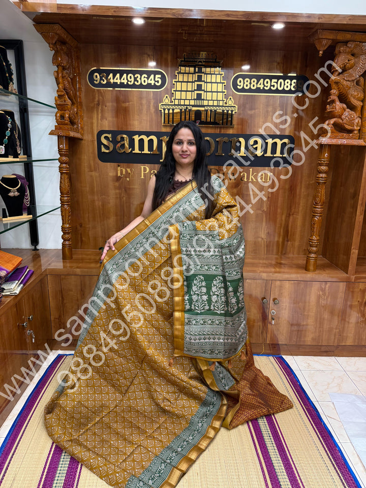 Mustard with Green  , Floral Prints in the body , Printed Blouse and Tassels in the Pallu , Soft Cotton Saree