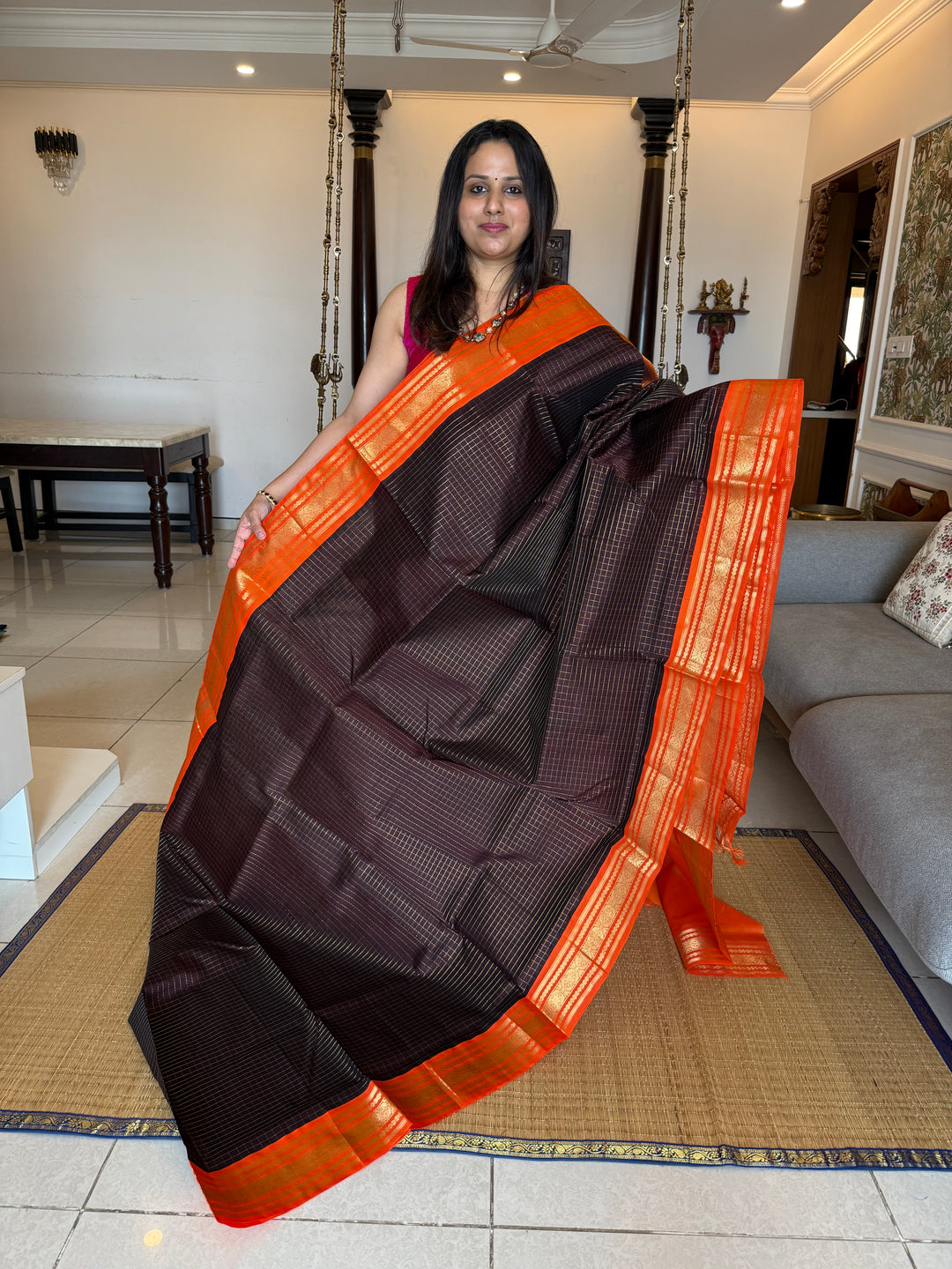 Dark Coffee Brown with Fanta Orange colour ,rich zari checks in the body ,traditional borders  and rich pallu Korvai Silk Cotton Saree