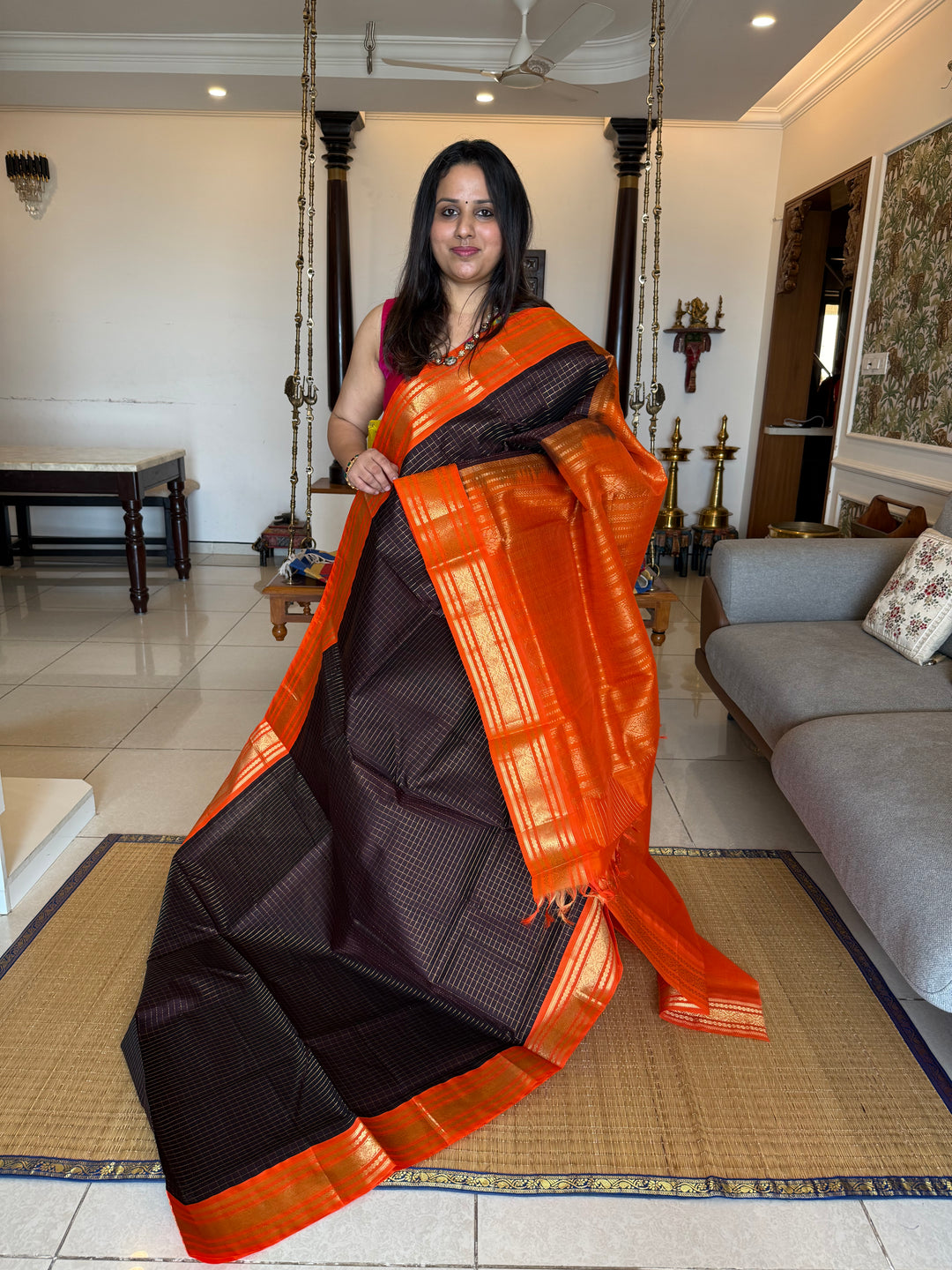 Dark Coffee Brown with Fanta Orange colour ,rich zari checks in the body ,traditional borders  and rich pallu Korvai Silk Cotton Saree