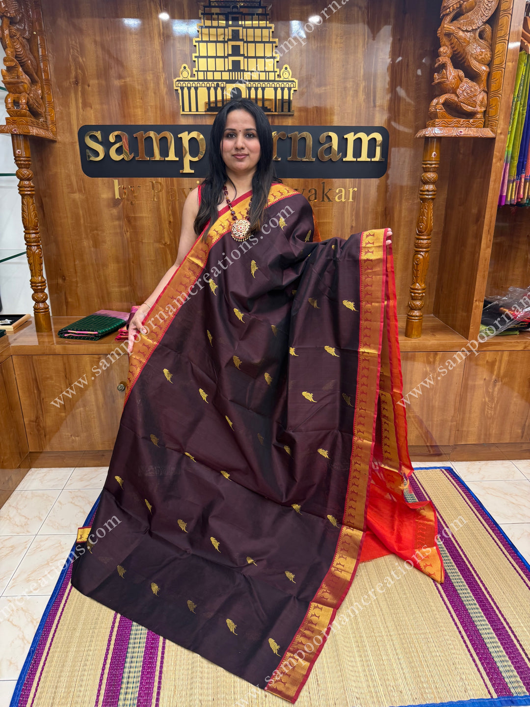 Dark Brown with Orange , Parrot Zari motif in the body and  traditional border , grand Pallu Silk Cotton Saree