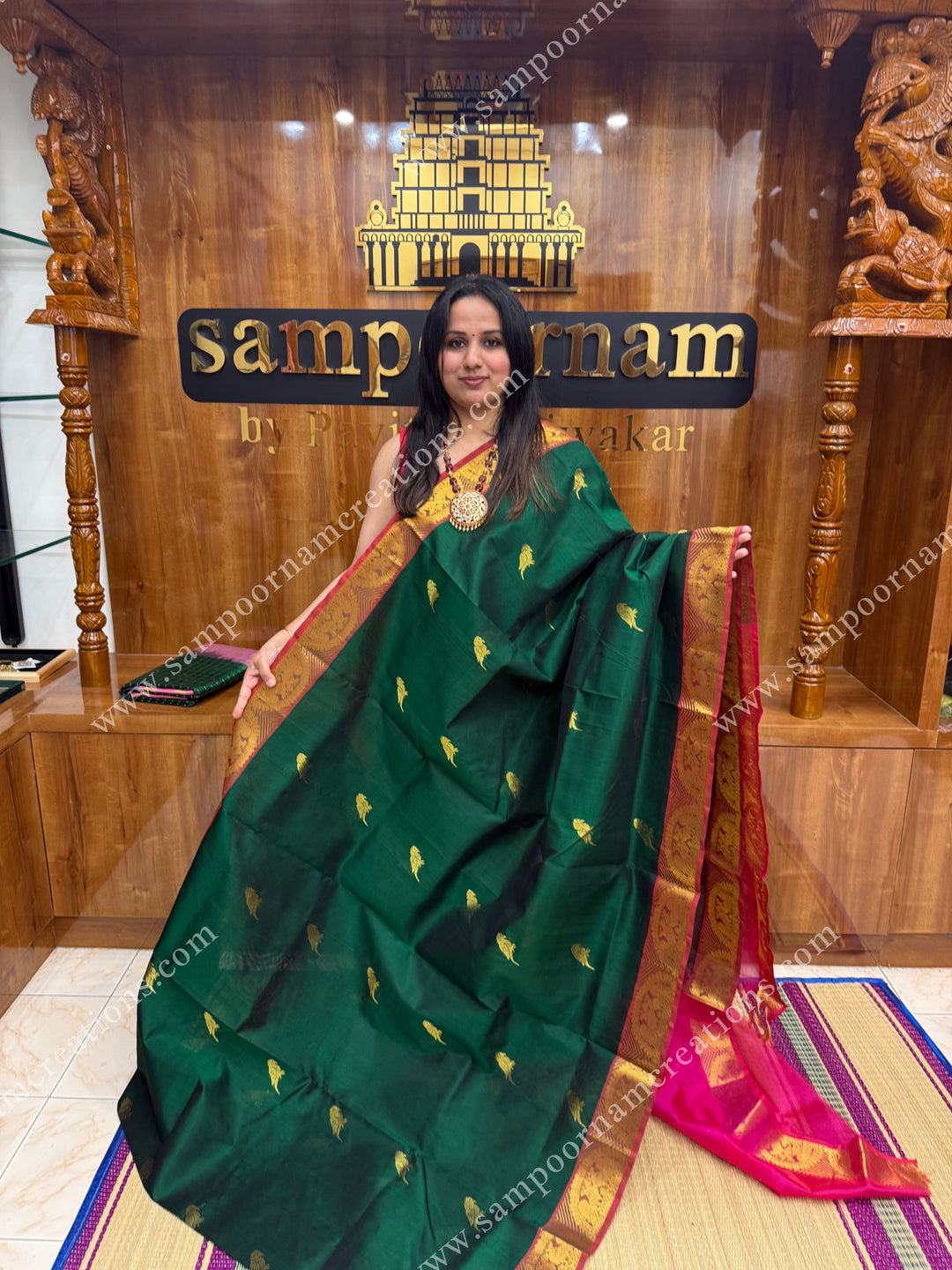 Green with Magenta , Zari Parrot motif in the body and  traditional border , grand Pallu Silk Cotton Saree