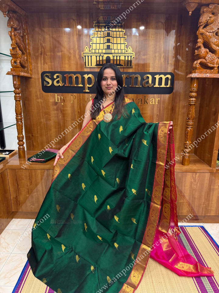 Green with Magenta , Zari Parrot motif in the body and  traditional border , grand Pallu Silk Cotton Saree
