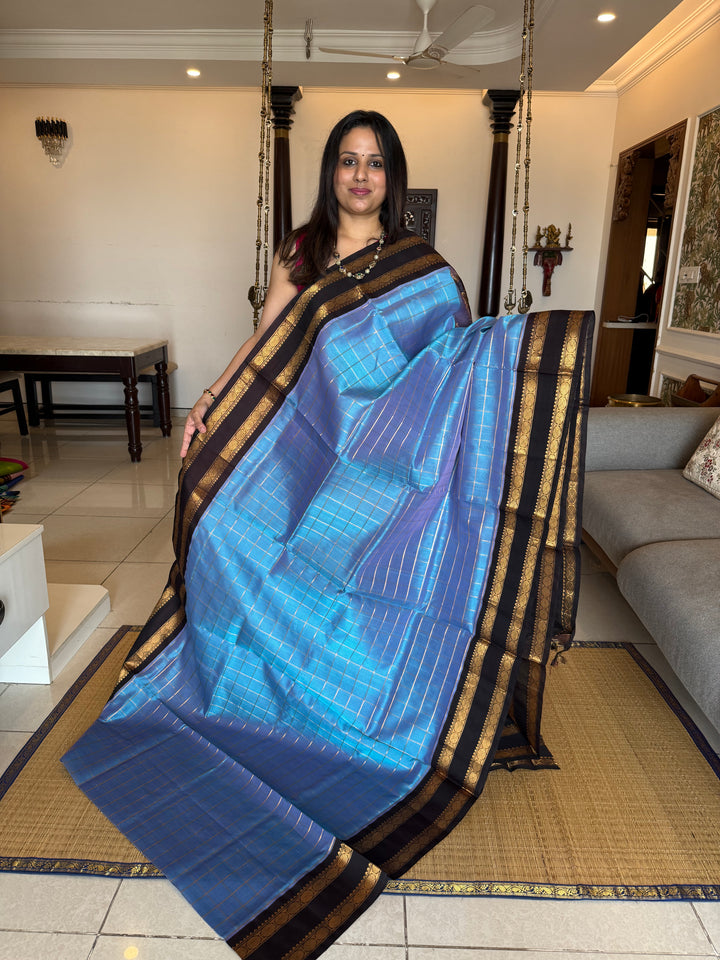 Steel Blue with Dark Brown  colour ,rich zari checks in the body ,traditional borders  and rich pallu Korvai Silk Cotton Saree