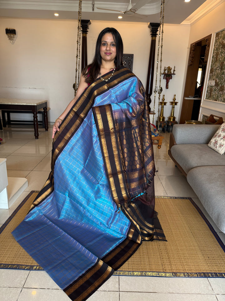 Steel Blue with Dark Brown  colour ,rich zari checks in the body ,traditional borders  and rich pallu Korvai Silk Cotton Saree